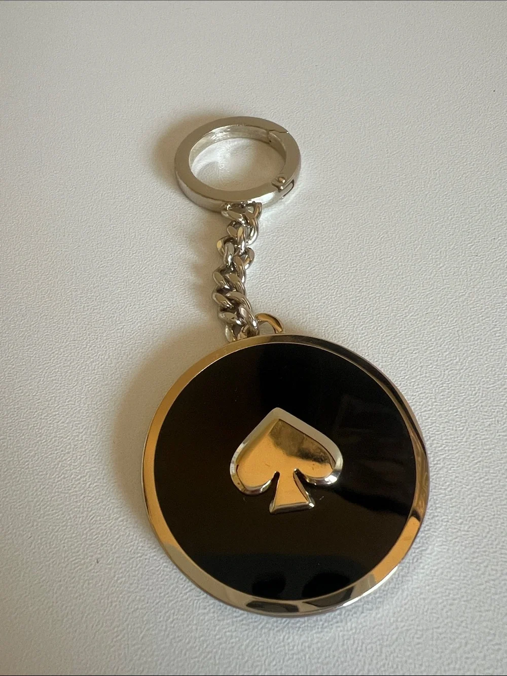 kate spade Black and Gold Round Spade Keychain